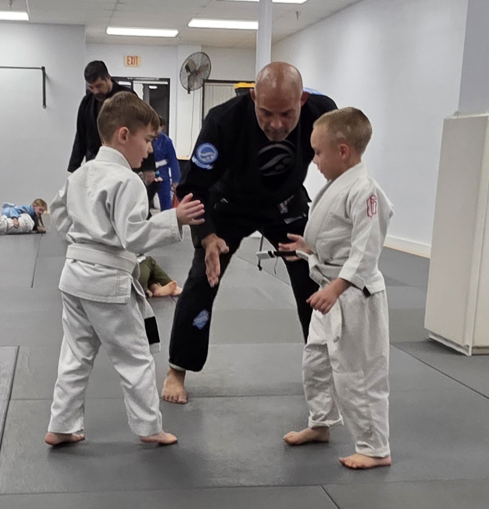 Coach teaching young kids fundamentals